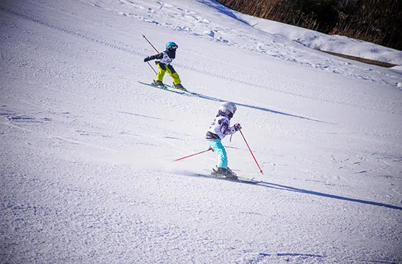 two children ski