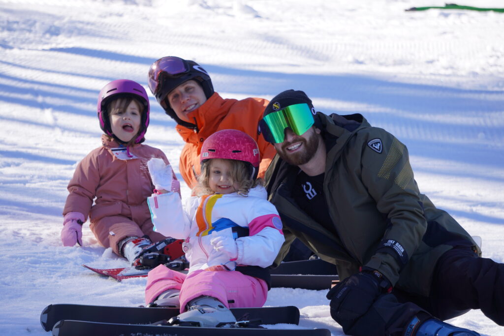 Family enjoying the snow at Holiday Mountain
